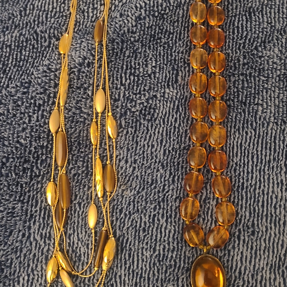 Monet costume necklace and a topaz costume beaded necklace.